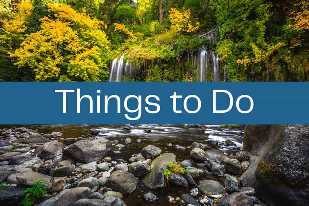 Scenic waterfall surrounded by lush green and yellow autumn foliage, with a rocky creek in the foreground. A bold blue banner across the center reads "Things to Do" in large white letters.